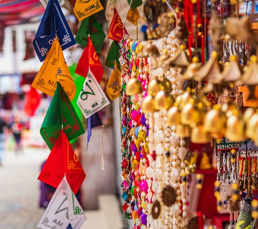 Prayer flags displayed for sale in a Tibetan market