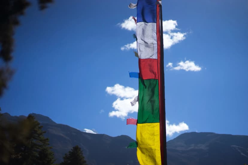 Darchor Tibetan prayer flags against a mountain backdrop